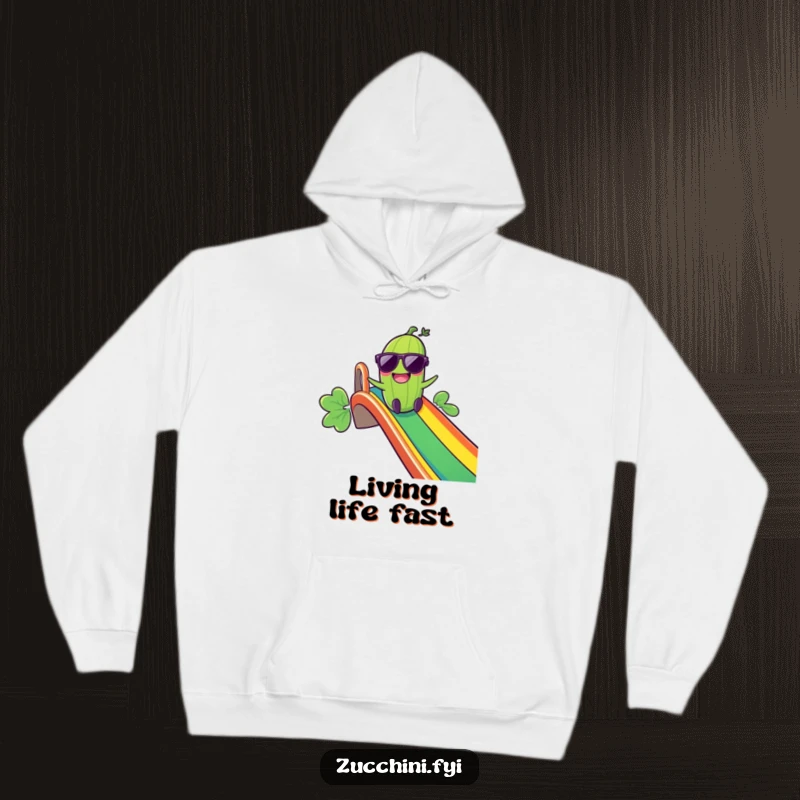 Funny Giggling Zucchini Hoodie: A zucchini in sunglasses laughs as it slides down a rainbow, offering warm and humorous comfort for chilly days.