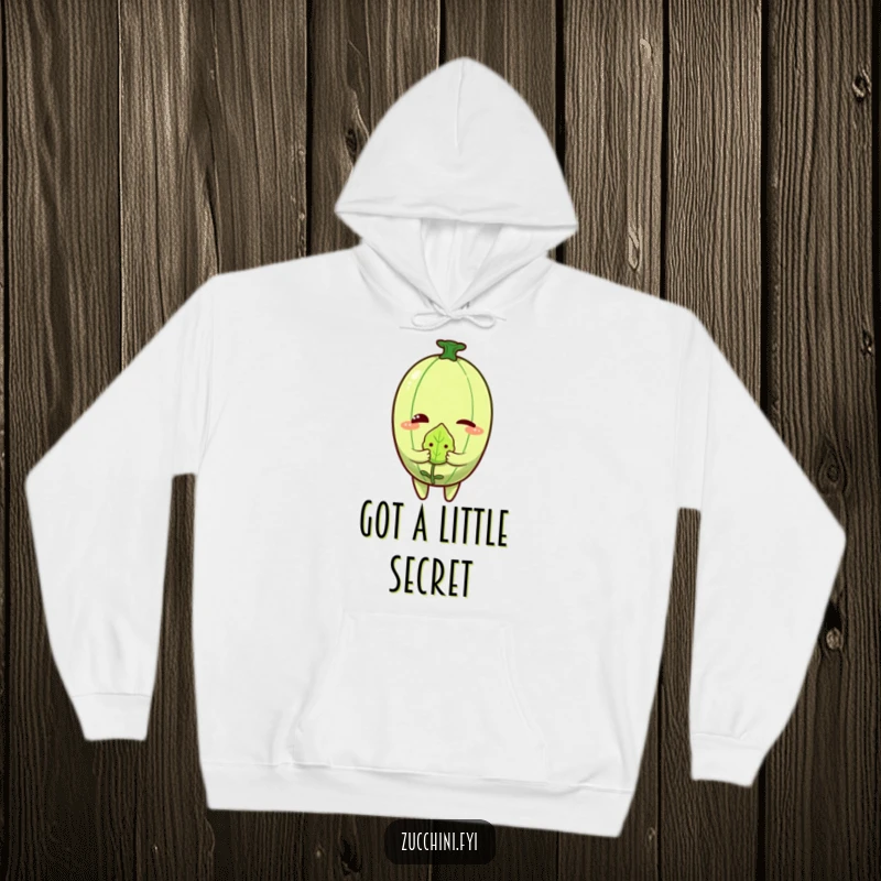 Funny Zucchini Wink Hoodie showing a winking zucchini character paired with a small, shy-looking leaf.