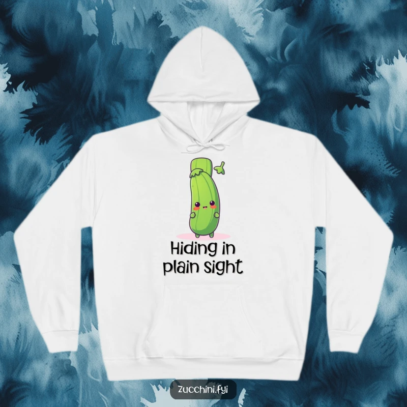 Funny zucchini hoodie with a cute zucchini character peeking from behind a giant, playful exclamation mark, offering warmth and humorous surprise.