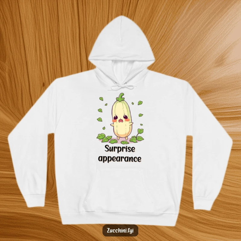 Funny startled zucchini hoodie depicting a shocked vegetable with leaves scattering, offering warmth and a chuckle.