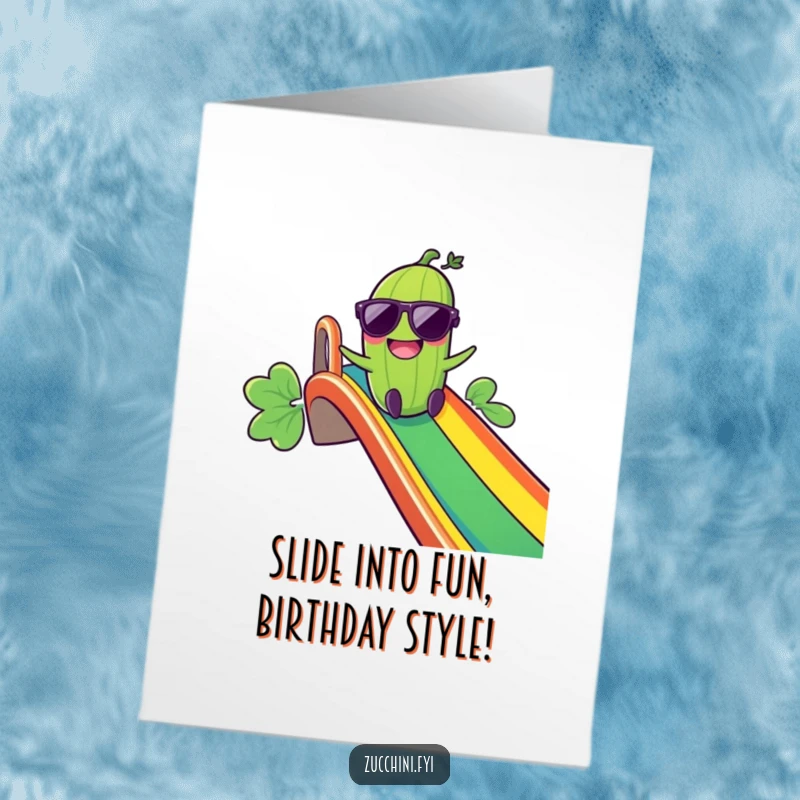 Funny free printable birthday card: Giggling zucchini in sunglasses zooming down a rainbow slide, bringing ultimate birthday fun.