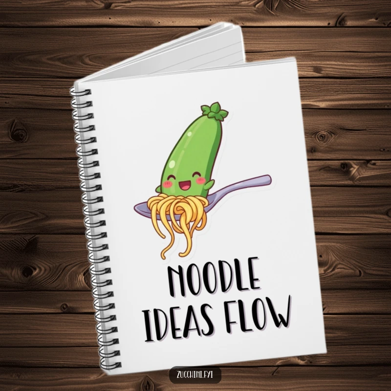 Funny notebook with a smiling zucchini noodle character sliding down a spoon, ideal for jotting down recipes and funny notes.
