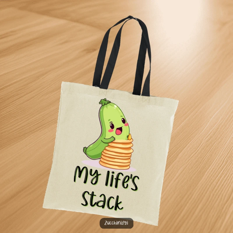 Funny tote bag featuring a determined zucchini trying to balance a wobbly stack of pancakes, perfect for daily errands.