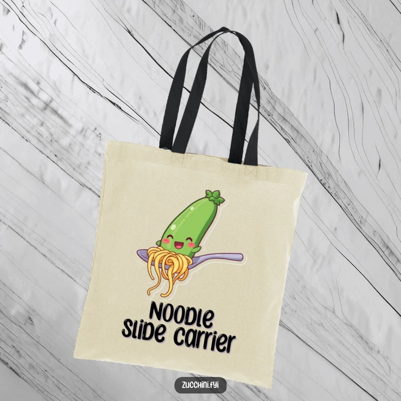 Funny tote bag featuring a happy zucchini noodle character mid-slide down a spoon, a whimsical and practical accessory for everyday use.
